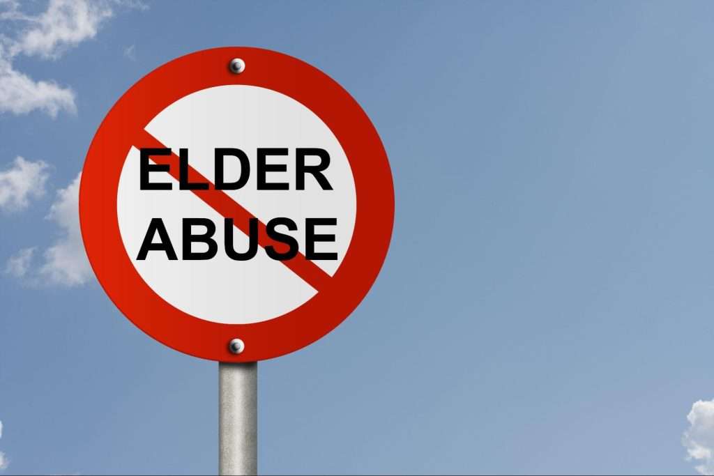 A road sign and no symbol and word Elder Abuse with sky background