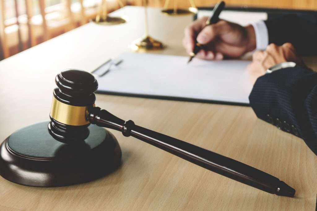 lawyer working on paper documents at courtroom.